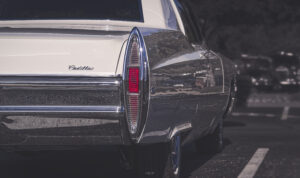 A Cadillac car is parked in a parking lot